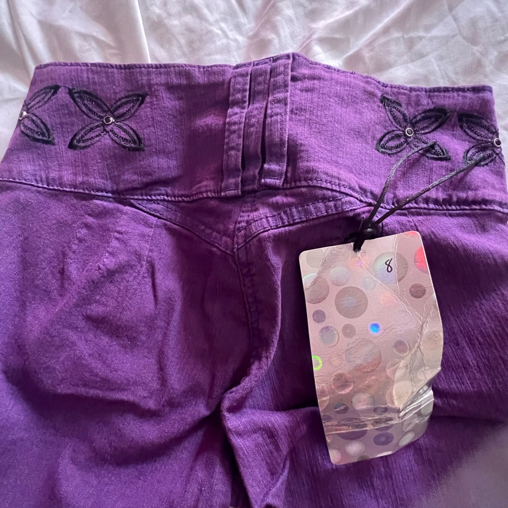 New jeans colombiano color purple and black beathiful size 8 for woman